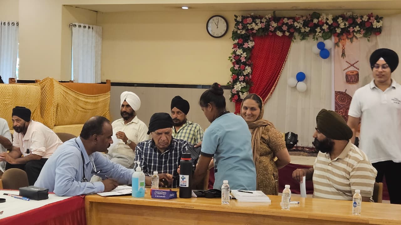Doctor consulting attendees at the Health Checkup Camp in Vapi